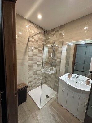 Shower, towels, soap, toilet paper