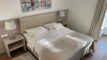In-room safe, desk, laptop workspace, blackout curtains