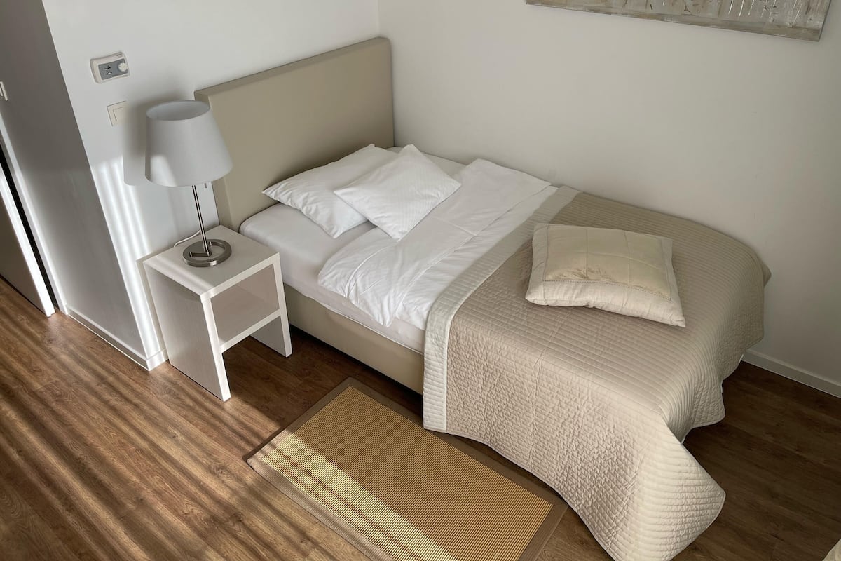 Premium Single Room, 1 Single Bed, Balcony, Canal View | In-room safe, desk, laptop workspace, blackout curtains