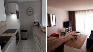 A modern kitchen with a built-in oven and a dining area with a wooden table and chairs. - Superb T2 Hyper center Le Touquet (Le Touquet-Paris-Plage)