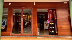 A storefront with a sign reading "AOWMANA". - Aowmana Hotel (Bangkok)