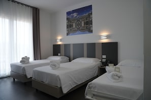 Triple Room | Premium bedding, down comforters, minibar, in-room safe - HOTEL MOSAICO (Matera)
