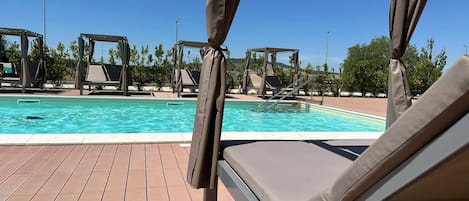 Seasonal outdoor pool, pool umbrellas, sun loungers