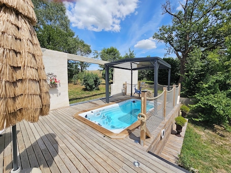 A heated pool. Les 3 Clefs de GaYa Well-being & private spa: swim spa, sauna, massage bed.