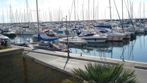 A marina with numerous boats docked.