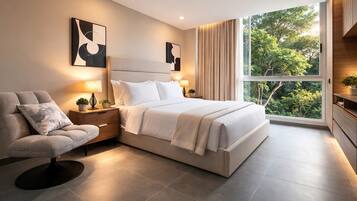 A modern bedroom with a bed, bedside tables, a chair, and a large window with a view of trees.