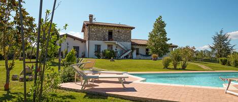 Seasonal outdoor pool, pool umbrellas, pool loungers