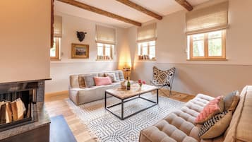 Luxury Apartment | Living area | 32-inch TV with cable channels