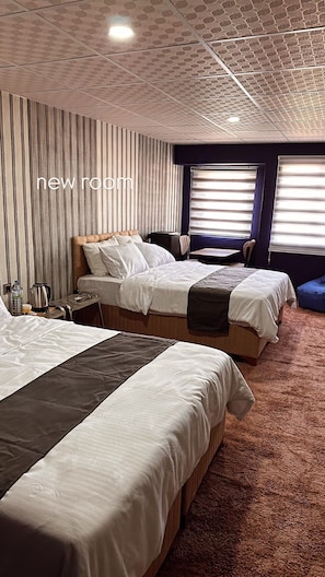 Deluxe Quadruple Room | Desk, laptop workspace, free WiFi, bed sheets