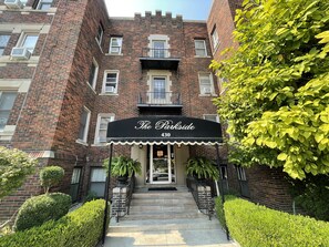 A brick building with a black awning labeled "The Parkside 430". - Charming Renovated One Bedroom Apartment. (Windsor)