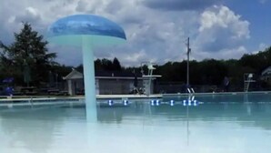 A swimming pool with a large blue umbrella structure in the center. - LAKEFRONT - Lake Escape - Arrowhead Lake Community (Pocono Lake)