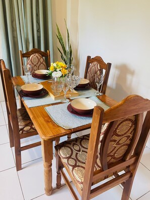 Basic Apartment | Private kitchen | Cookware/dishes/utensils, cleaning supplies