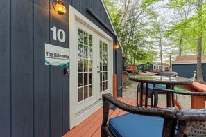 A wooden building with a sign reading "10 The Hideaway."