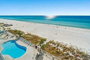 A beach resort with a swimming pool, beach, and clear blue sky. - Oversized Gulf-Front Watercrest 2BR Sleeps 8 Private Balcony East End PCB (PCB)