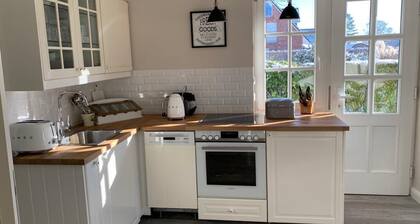 Bright apartment with direct access to the garden
