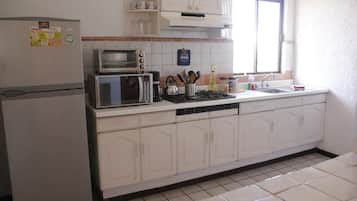 Economy Apartment | Private kitchen | Fridge