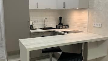 Fridge, microwave, electric kettle, cookware/dishes/utensils