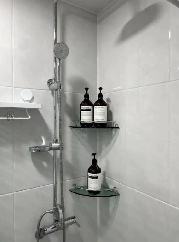 Shower, hair dryer, towels, soap
