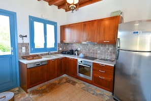 Villa | Private kitchen | Full-size fridge, oven, stovetop, dishwasher