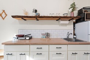 Fridge, microwave, stovetop, coffee/tea maker