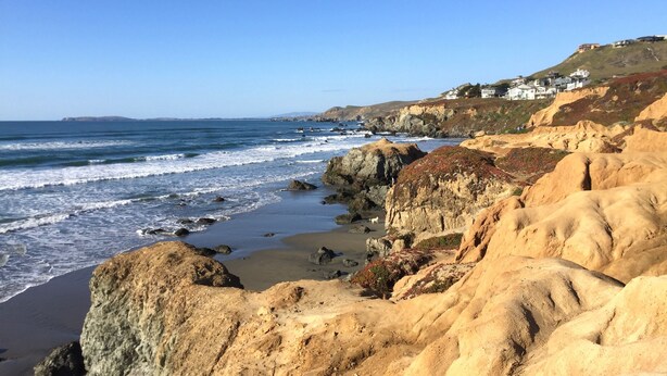 A coastal landscape with rocky cliffs and a beach. - Charming modern bungalow w/ hot tub steps away from the beach (Dillon Beach)