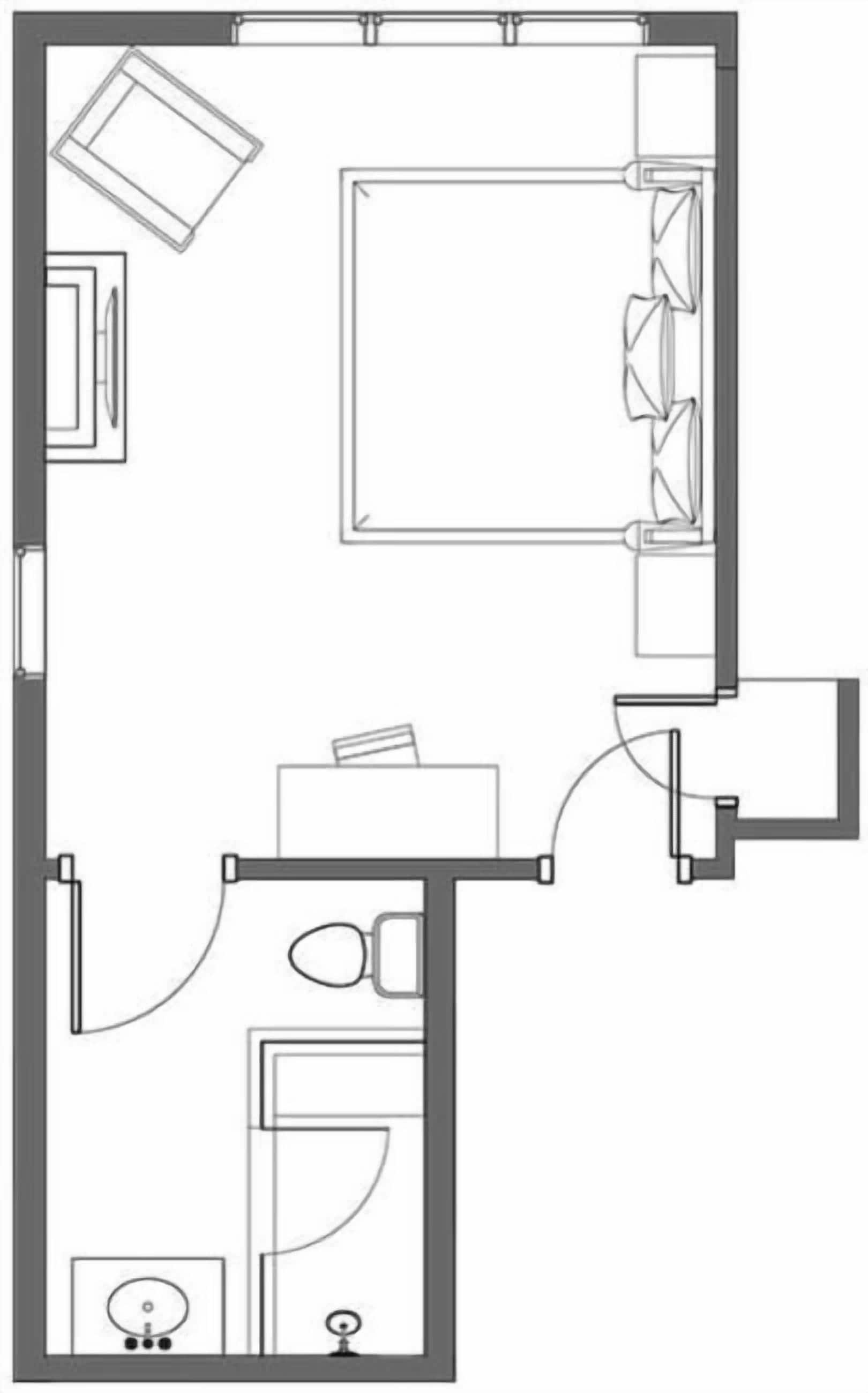 A floor plan with a bedroom, bathroom, and kitchenette.