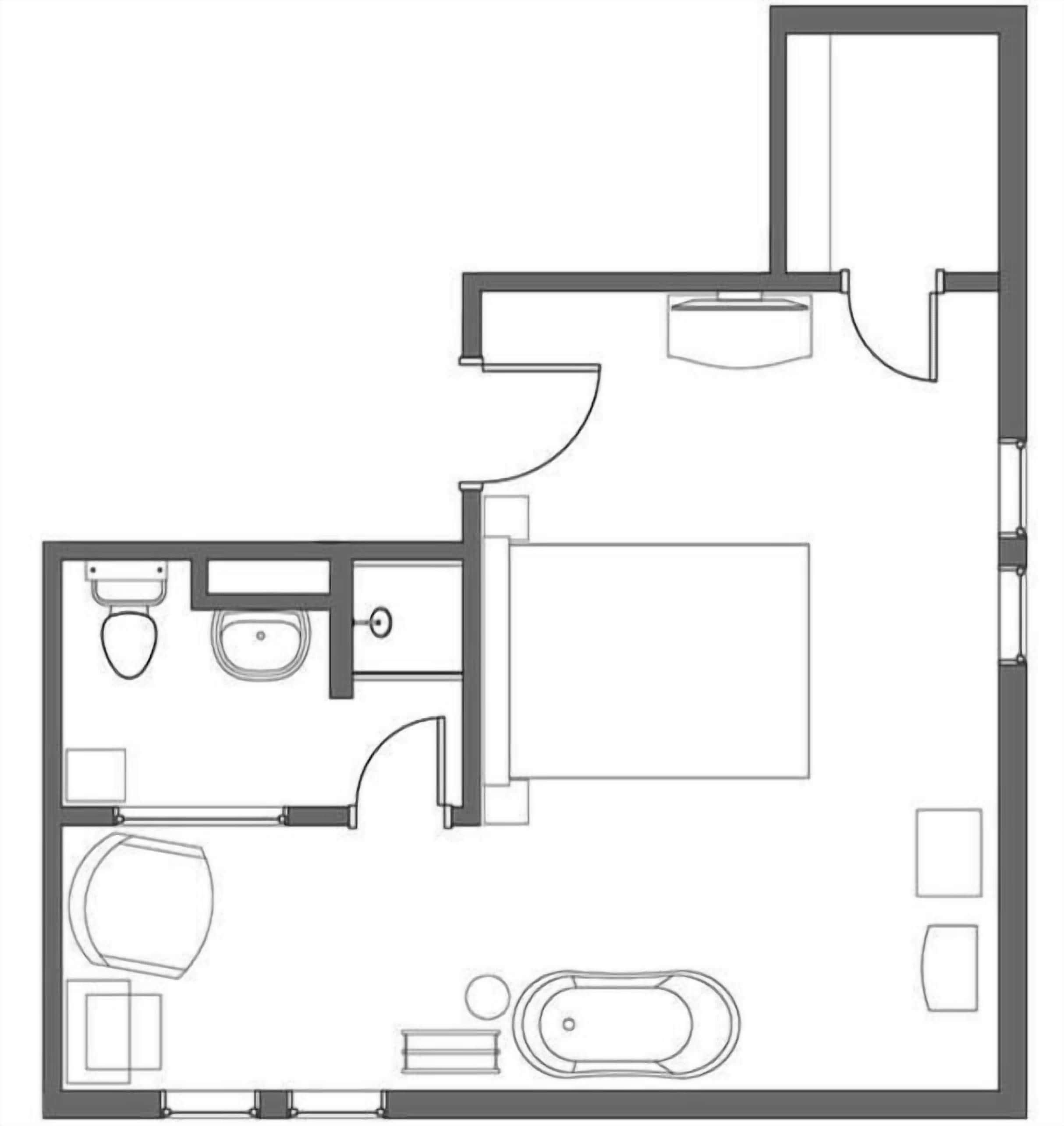 Un plan d’étage d’une chambre d’hôtel comprenant une salle de bain, un lit, un bureau et une chaise.