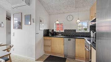 Fridge, stovetop, dishwasher, coffee/tea maker