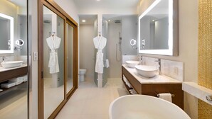 A modern bathroom with two sinks, a large mirror, and a walk-in shower. - Spacious Two Bedroom Suite....Amazing Pools including a Lazy River (San José del Cabo)
