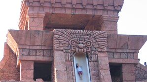 A stone structure with a central slide. - Harborside Resort @ Atlantis 2 BR Sleep 6-8 (Nassau)