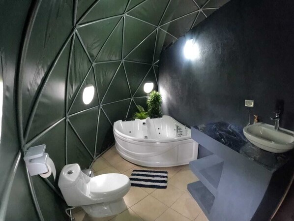 Bathtub, jetted tub, bathrobes, towels