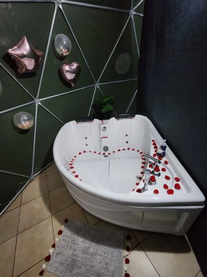 Bathtub, jetted tub, bathrobes, towels