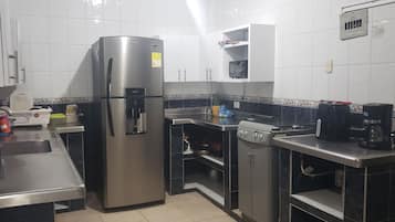 Full-size fridge, oven, stovetop, espresso maker