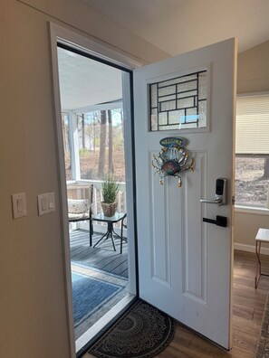 A door with a welcome sign, a glass panel, and a doorbell. - Flossie's, Southern 3BR Retreat- 1.8 Acres, Minutes to Beaufort & Parris Island. (Seabrook)