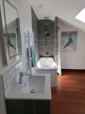 Bathtub, hair dryer, towels