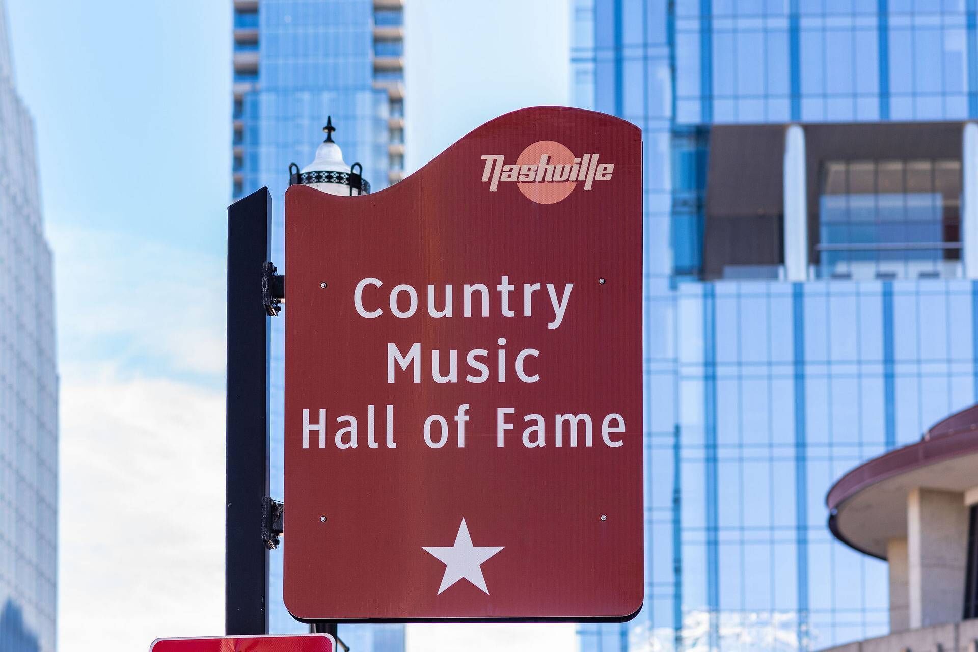 A sign for the Country Music Hall of Fame with a star symbol.