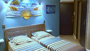 A bedroom with a bed, two bedside tables, a wall-mounted artwork, and a door. - A corner of paradise for 10 guests in Drôme Provençale (Buis-les-Baronnies)