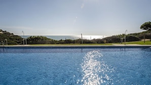 A swimming pool with a clear view of the ocean and a sunny sky. - Cristina by Interhome (Conil de la Frontera)