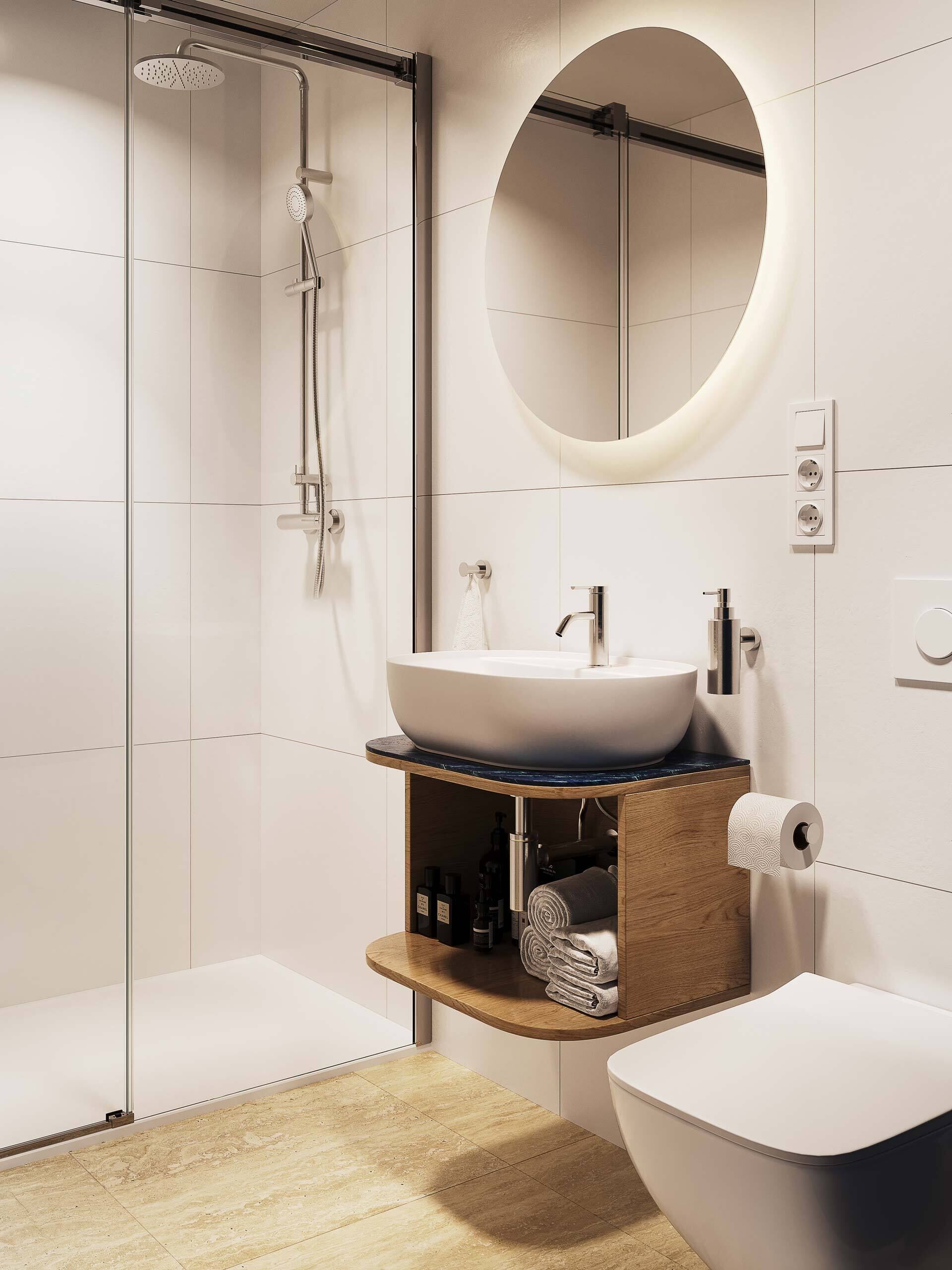A modern bathroom with a glass shower enclosure, a round mirror, a white sink, and a toilet.