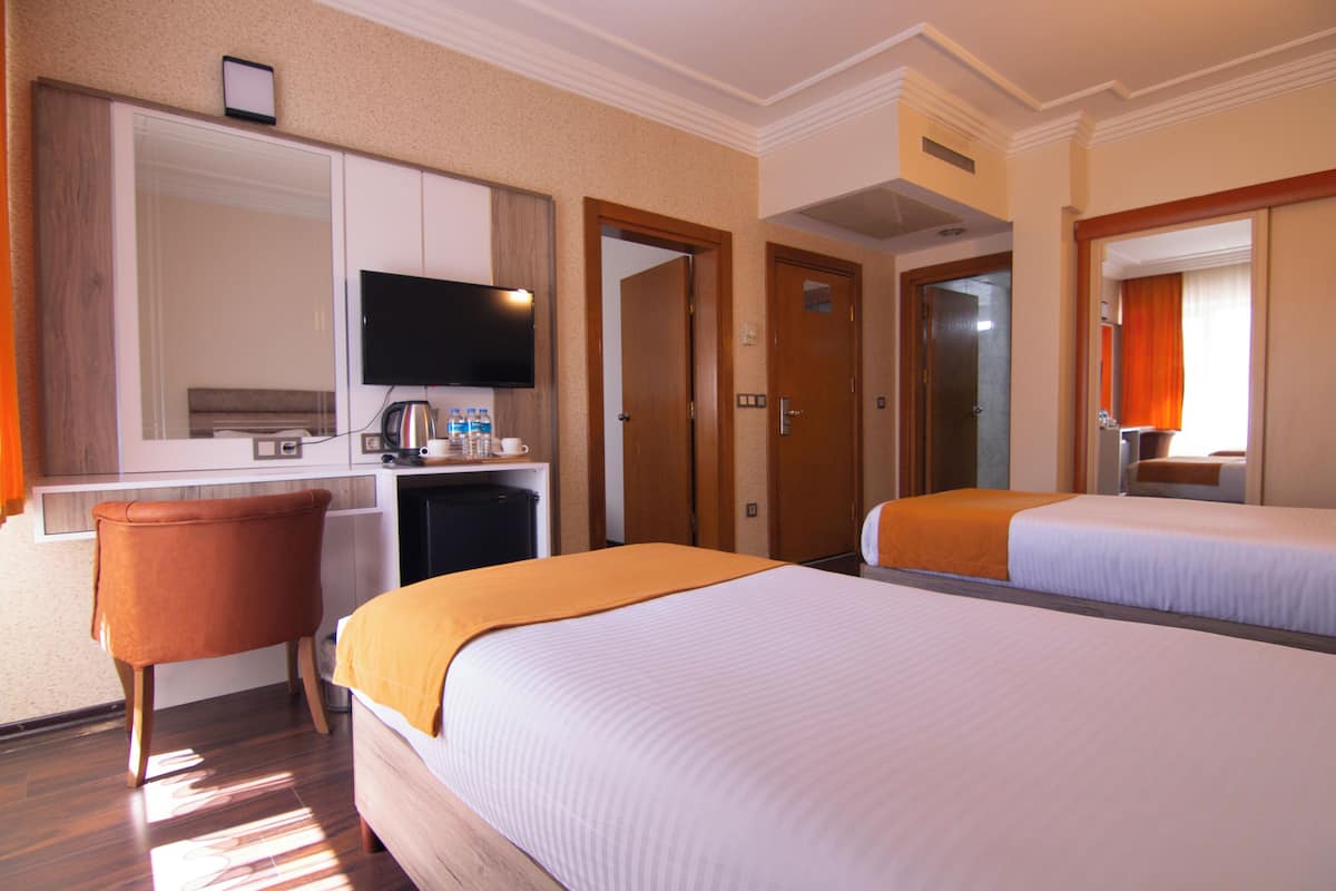 family quadruple room | bathroom | rainfall showerhead, designer toiletries, hair dryer, slippers