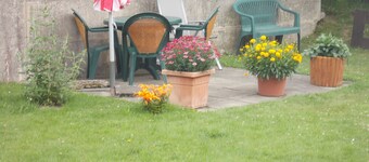 A spacious, family-friendly apartment with a large garden