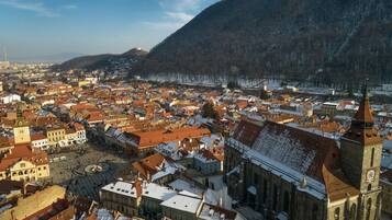A historic town with a prominent church and a large square.