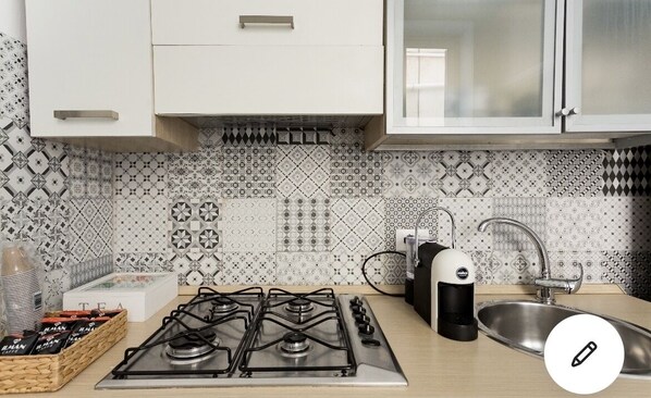 Fridge, microwave, stovetop, coffee/tea maker