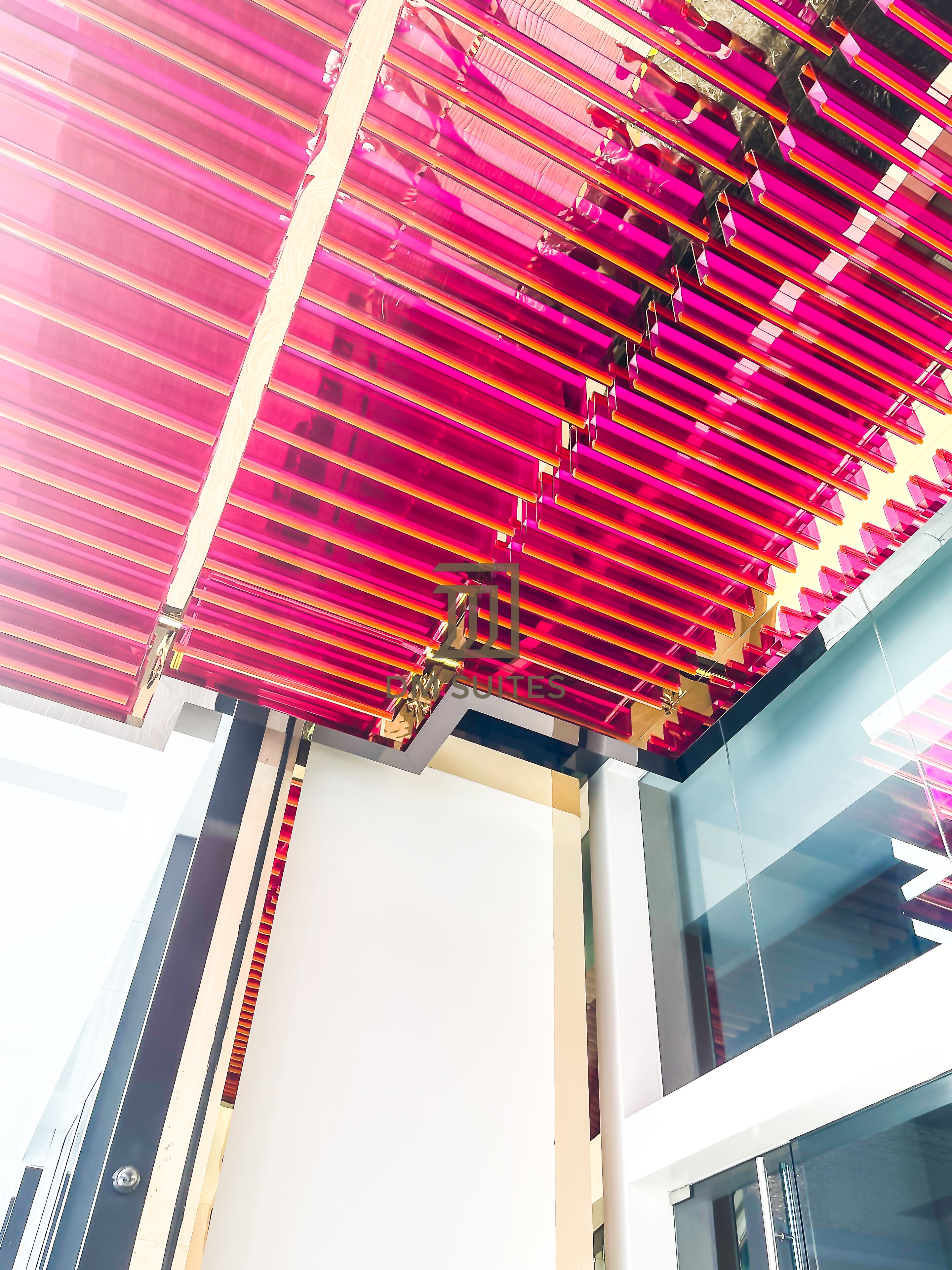A modern building with a distinctive red and white striped ceiling.