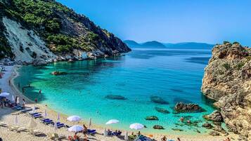 On the beach, sun loungers, beach towels