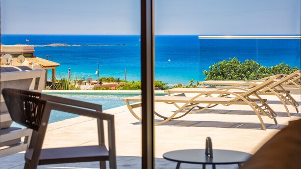 A poolside area with lounge chairs and a view of the ocean. - New Villa★Prive Pool★Walk to all & Falasarna beach★FREE Daily Breakfast (Falasarna Crete)