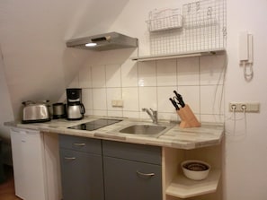 Fridge, stovetop, coffee/tea maker, toaster