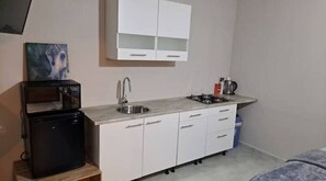 Fridge, microwave, stovetop, cookware/dishes/utensils