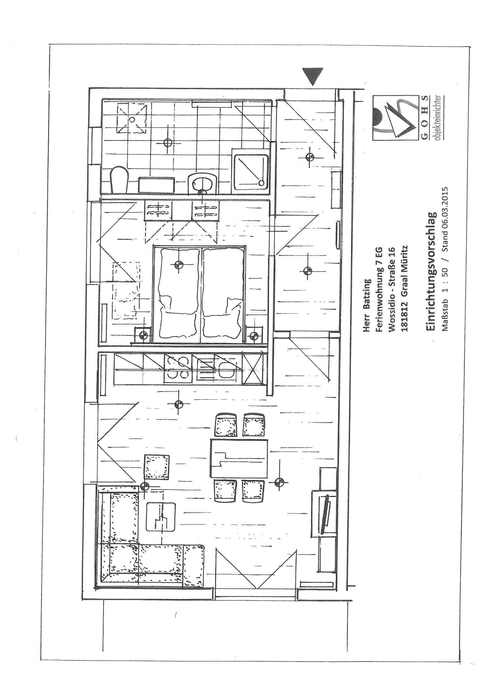 A floor plan of a hotel room with a bathroom, kitchenette, and a seating area.
