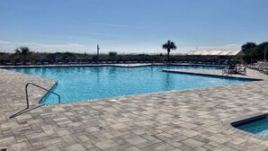 A swimming pool with lounge chairs and a palm tree. - Ocean View 1-Bedroom. Steps to the beach. Sleeps 6. (Hilton Head Island)